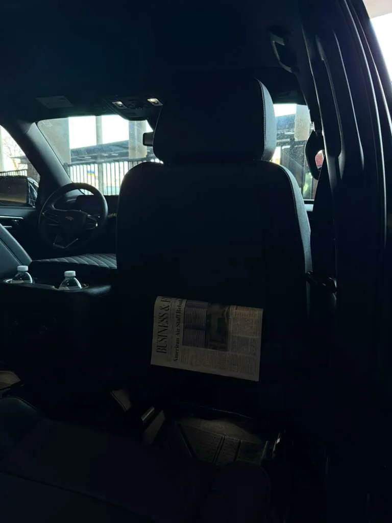 Interior view of a Chevrolet Suburban Luxury SUV, illustrating luxury amenities for corporate travelers